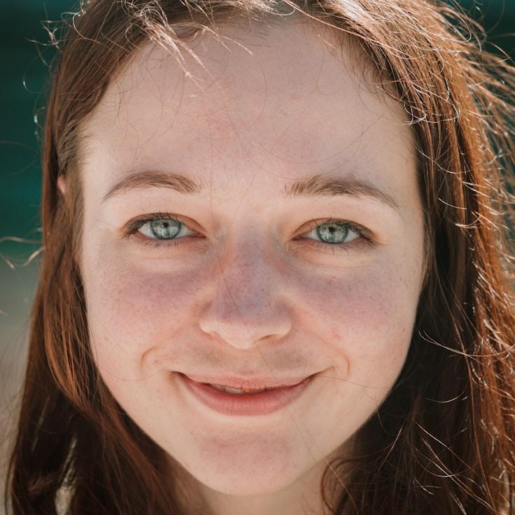 Alex Carter, Lead Design Curator at ShadyForestBench, reviewing corporate floral arrangements